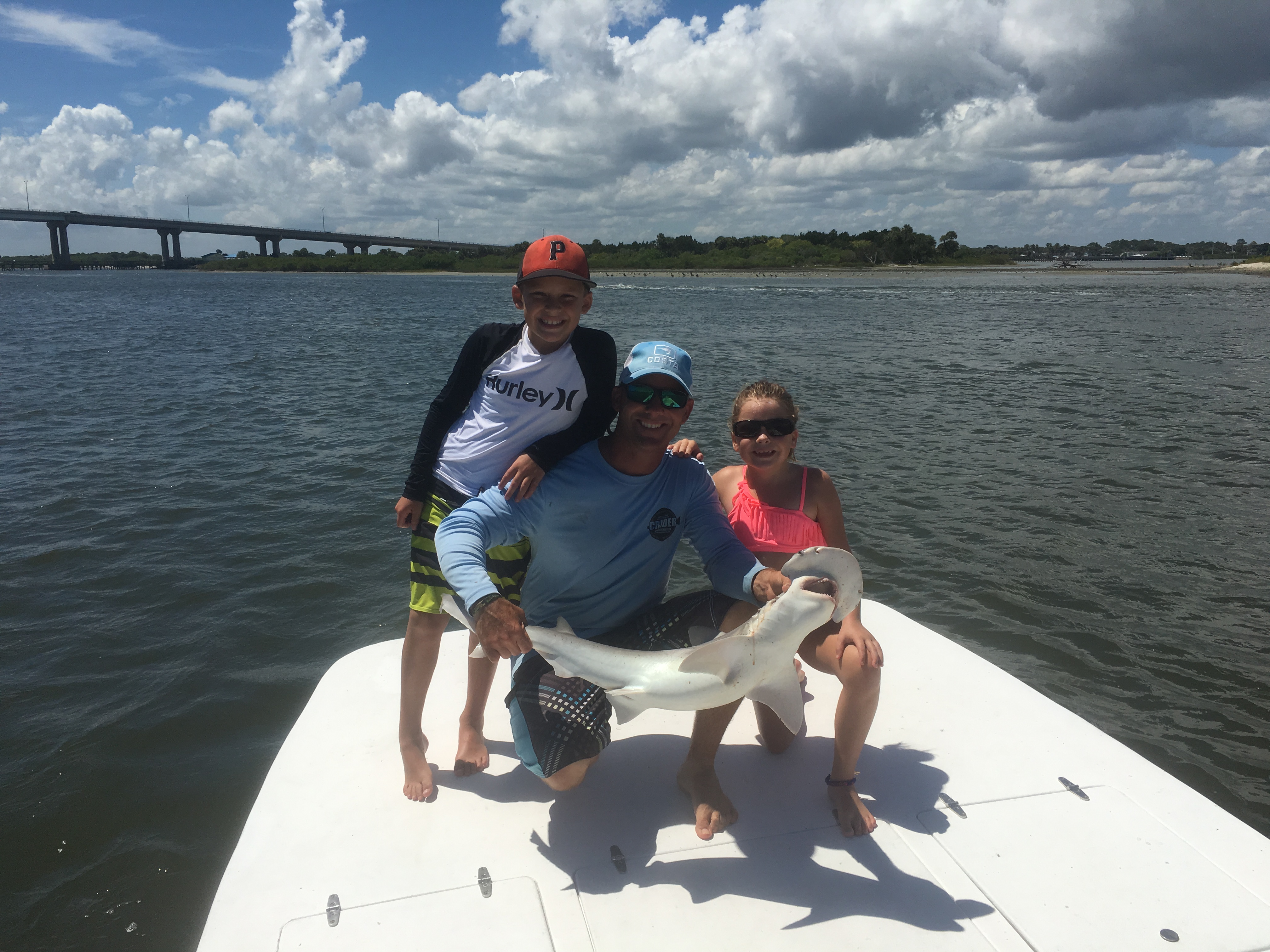 Happy young anglers with a Shark