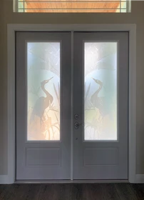 A Regal Decorative Glass Entry Doors Design with Herons.