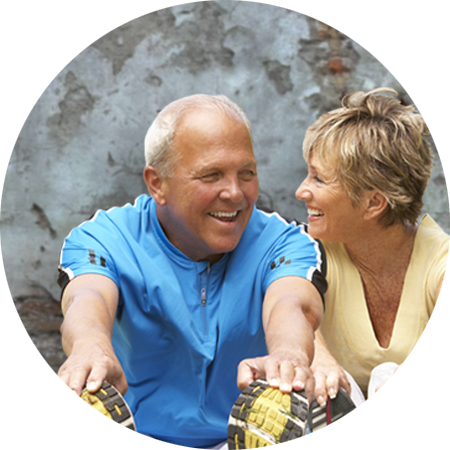 Older man and woman chatting while exercising
