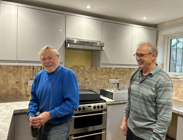 Vic and Rob O enjoying the kitchen remodel