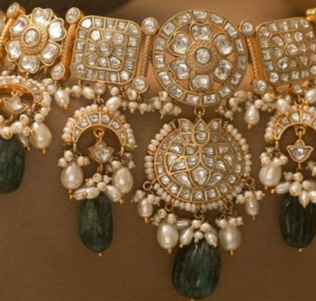 Tier 2 city founder showcasing bespoke Jadau jewellery in a modern showroom, blending heritage and contemporary luxury."