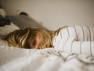 Lady with Insomnia on bed