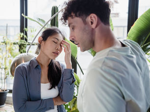 Couple arguing with female parter showing signs of distress