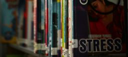 Books on a shelf with Stress Cover on one book