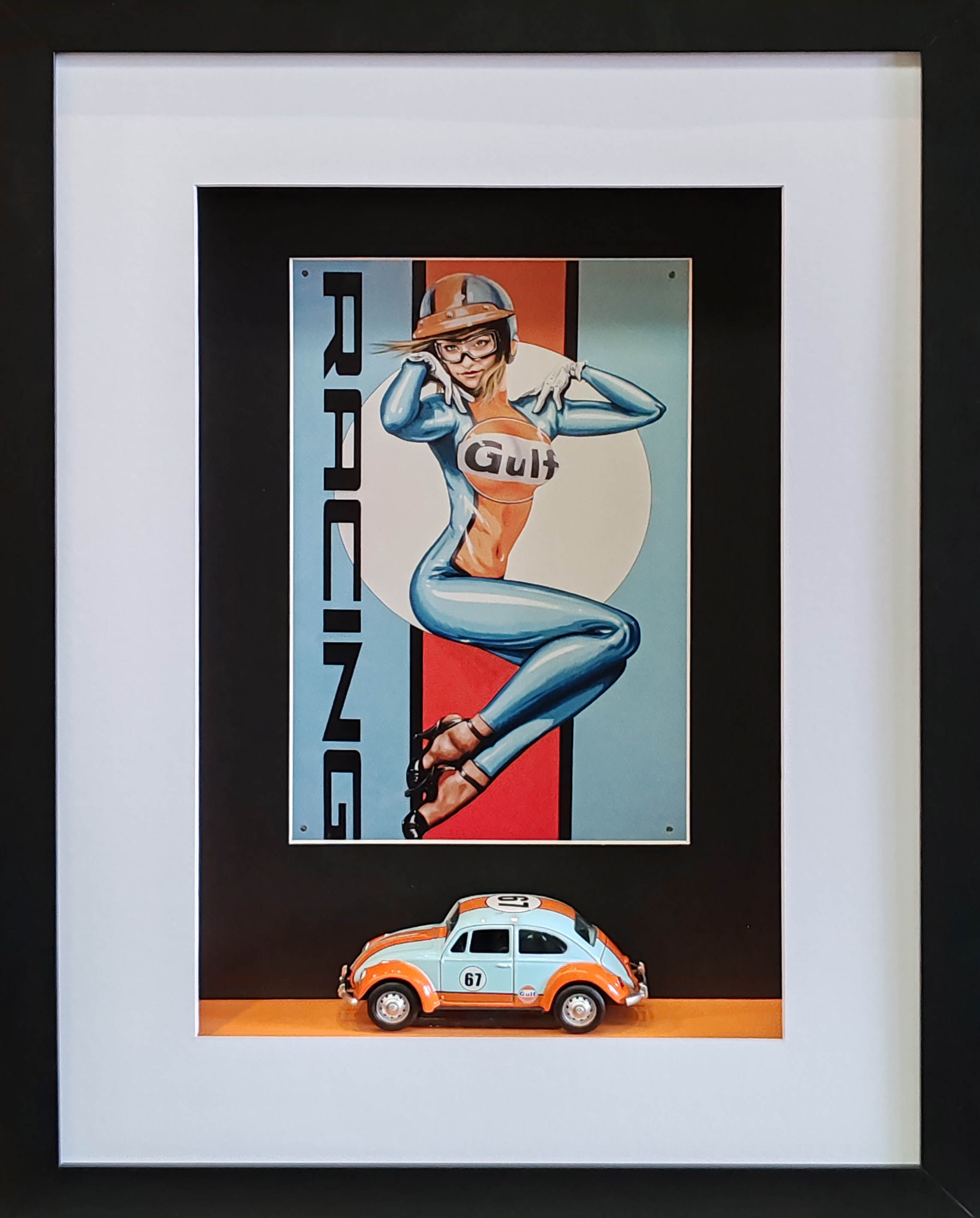 Framed VW Beetle diorama with 1:32 scale Gulf Racing livery model and retro racing pin-up poster background.
