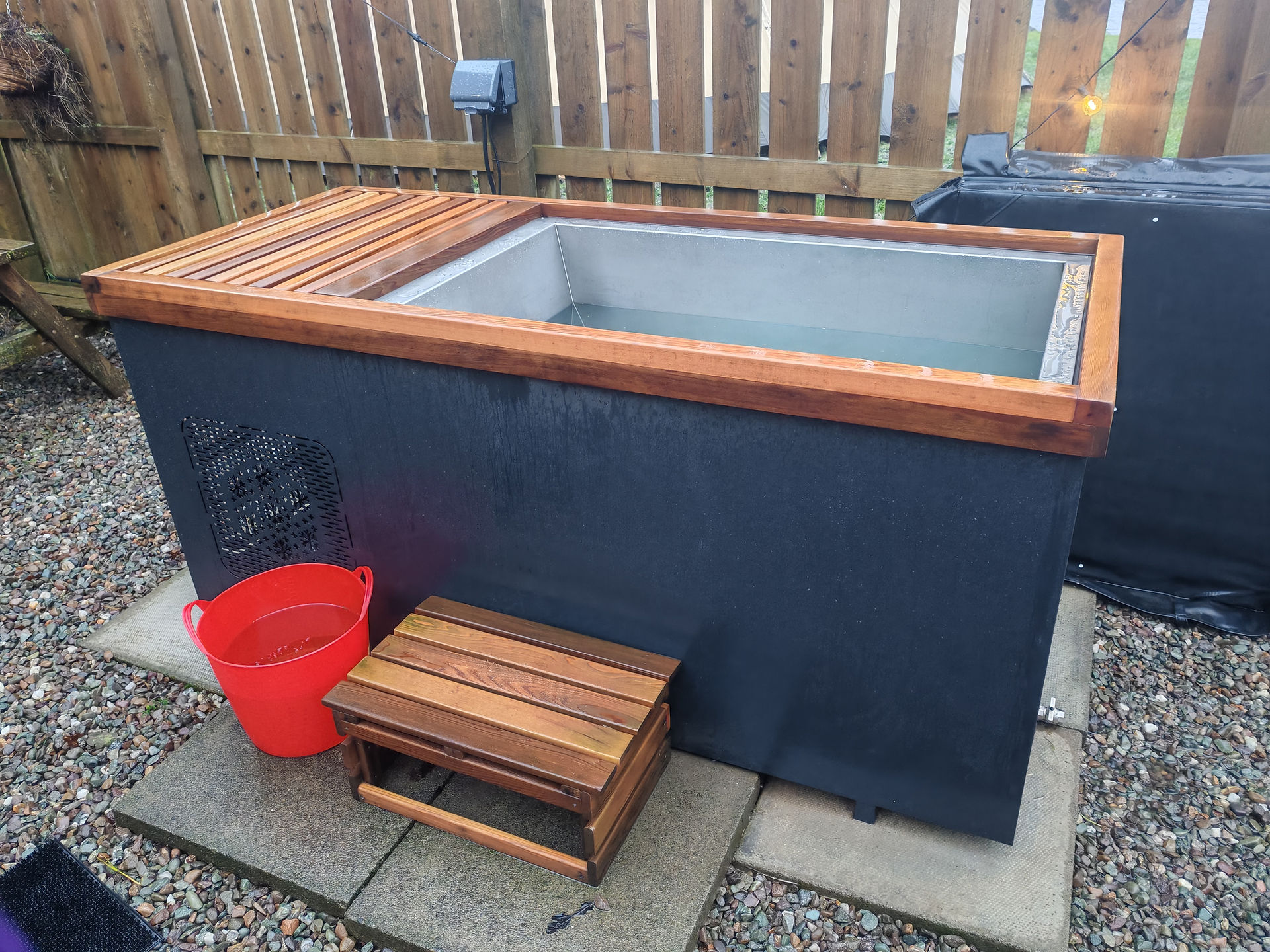 Cold plunge pool with wooden step