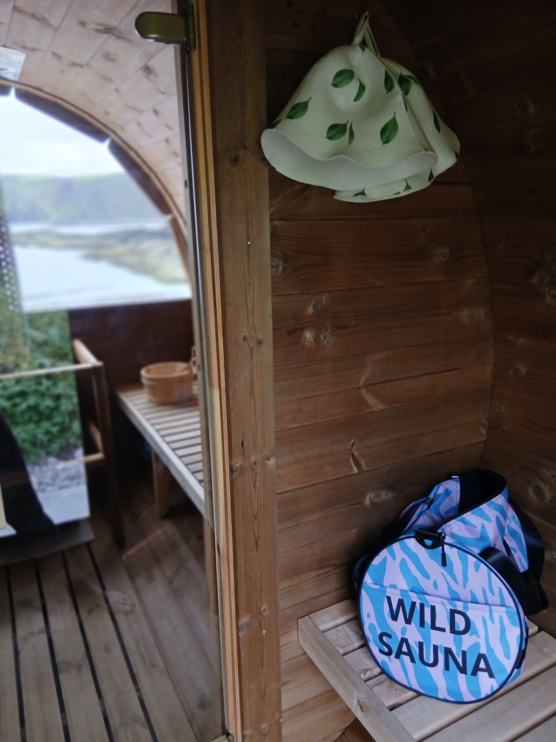 Entrance area to sauna with Wild Sauna bag and sauna hats