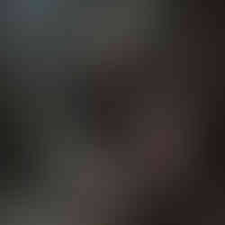 a dramatic confrontation between Geralt of Rivia, wielding a sword and chain, and a ferocious, monstrous creature