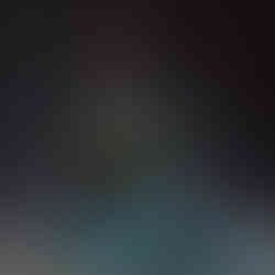 an elderly, bearded man dressed in green robes and a staff, posed dynamically above a swirling water