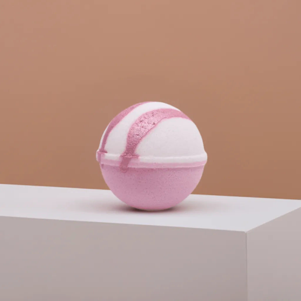 Bath Bomb sitting on beam Rose Petal Flavor. 