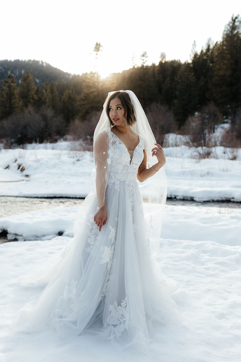 A bride with a veil in the mountains