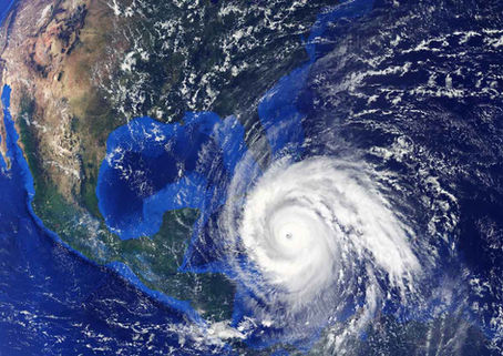 an aerial view of a hurricane approaching North America