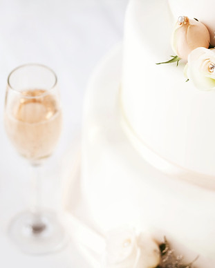 Wedding Cake And Champagne Flutes On Tab