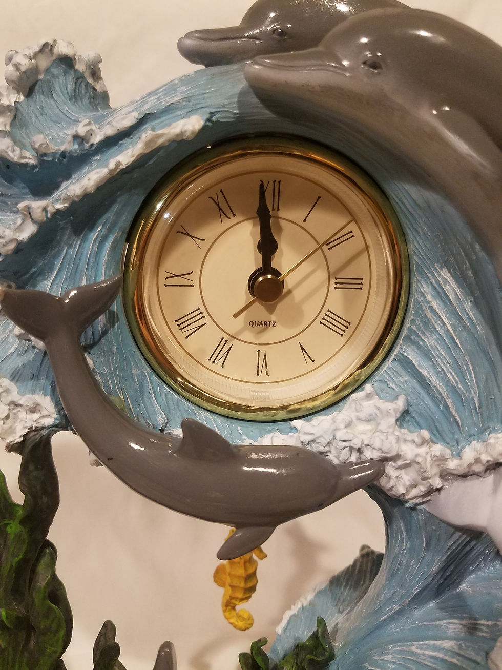 Thumbnail: Ceramic dolphin clock with a water globe