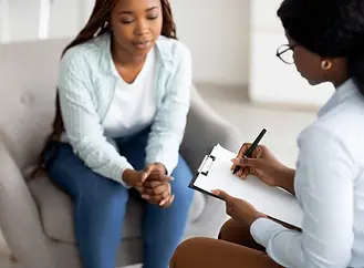 stressed-black-female-patient-consulting-600nw-2067591344.webp