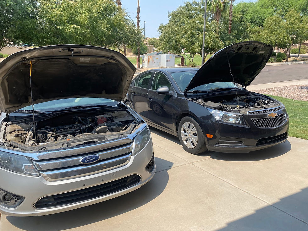 Chevy Cruise and Ford Focus with Hoods Up