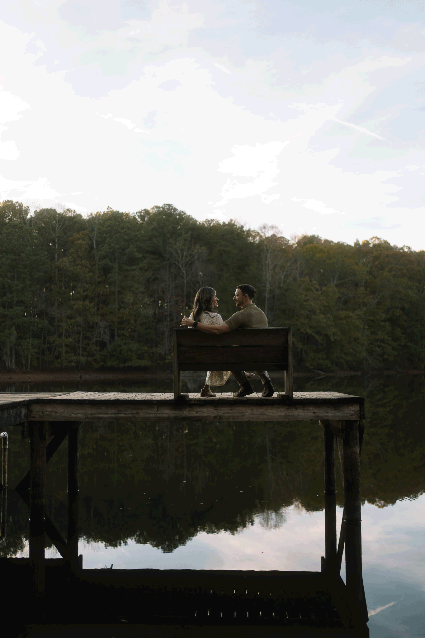 Gif of a couple kissing while sitting on a bench on a pier at Madison Nature Trail on Green Mountain (by Kaleigh Madison)