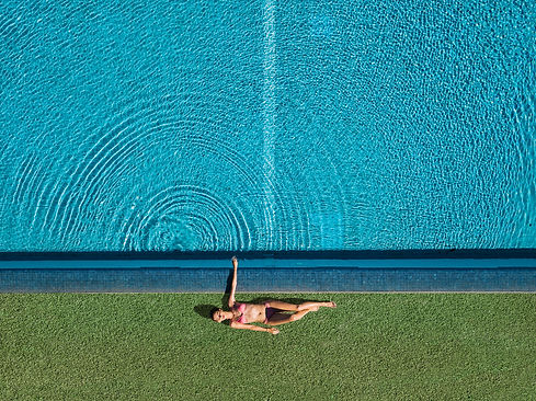 top-view-girl-relaxing-pool.jpg