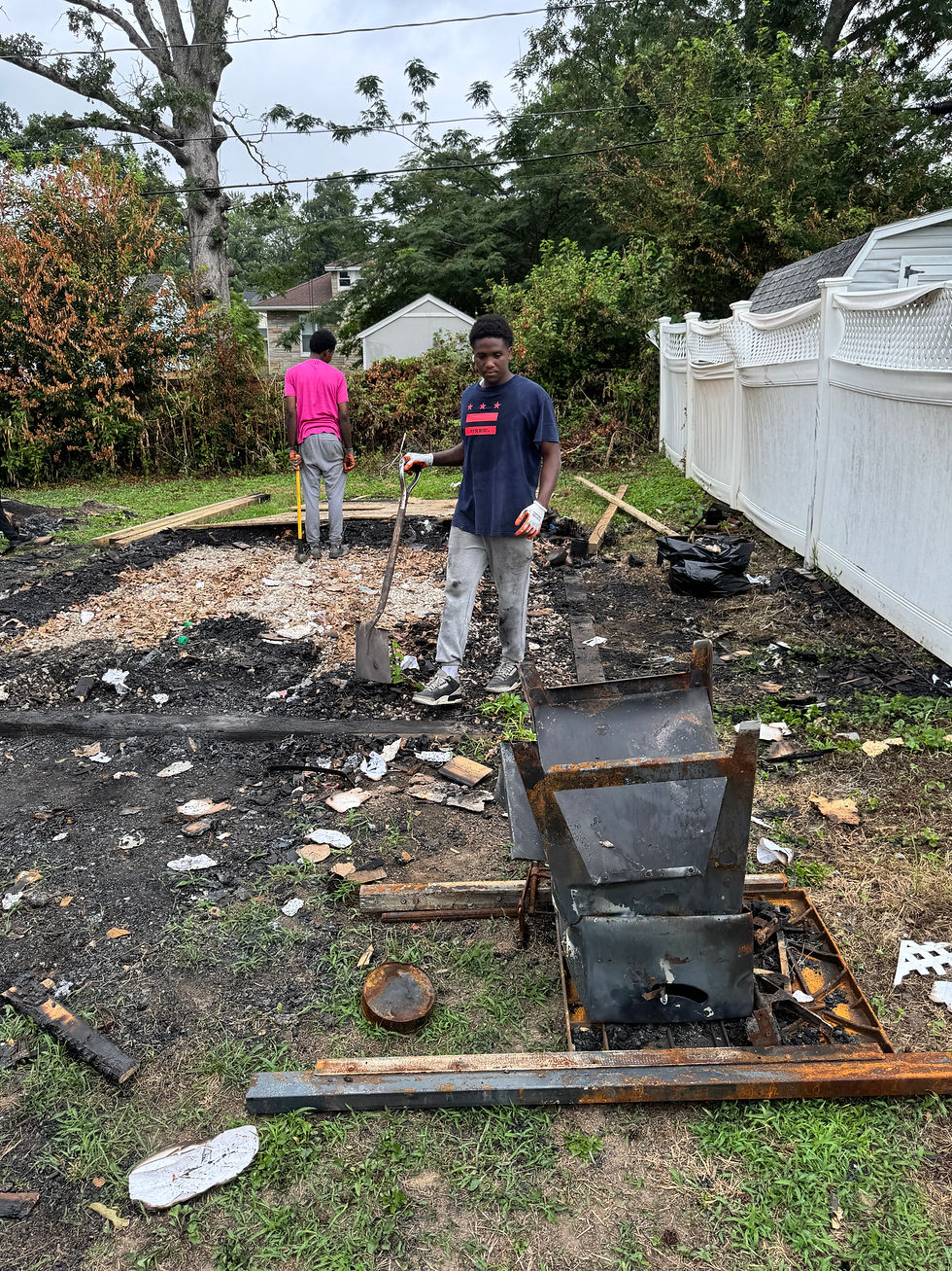 Horton's Hauling crew removing a backyard shed in Baltimore, MD