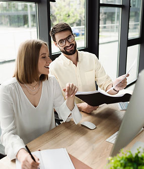 Employee Solutions - HR manager reviewing documents with employees.jpeg