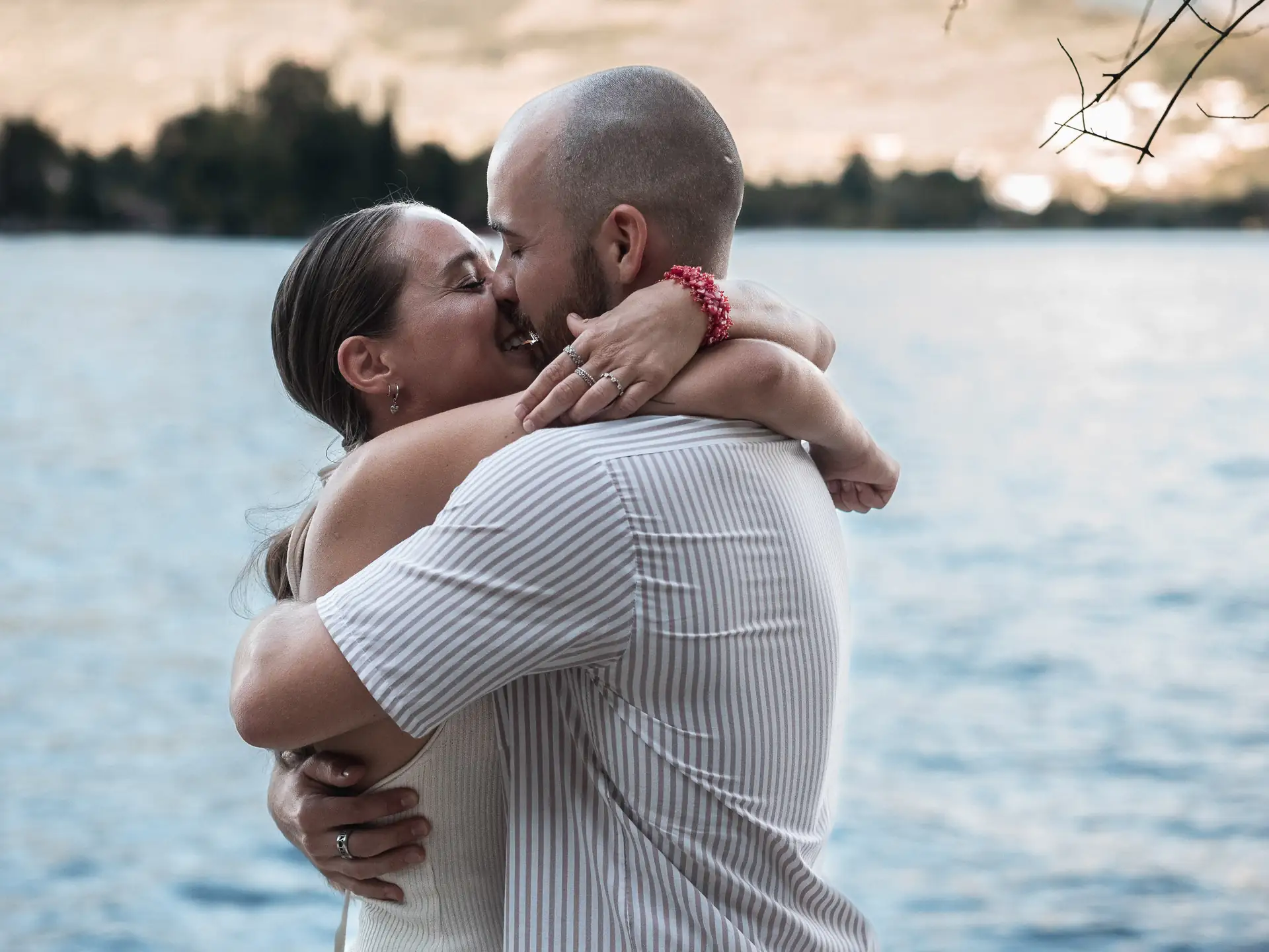 Aaron and Tamara hugging after the surprise proposal in Limone sul Garda