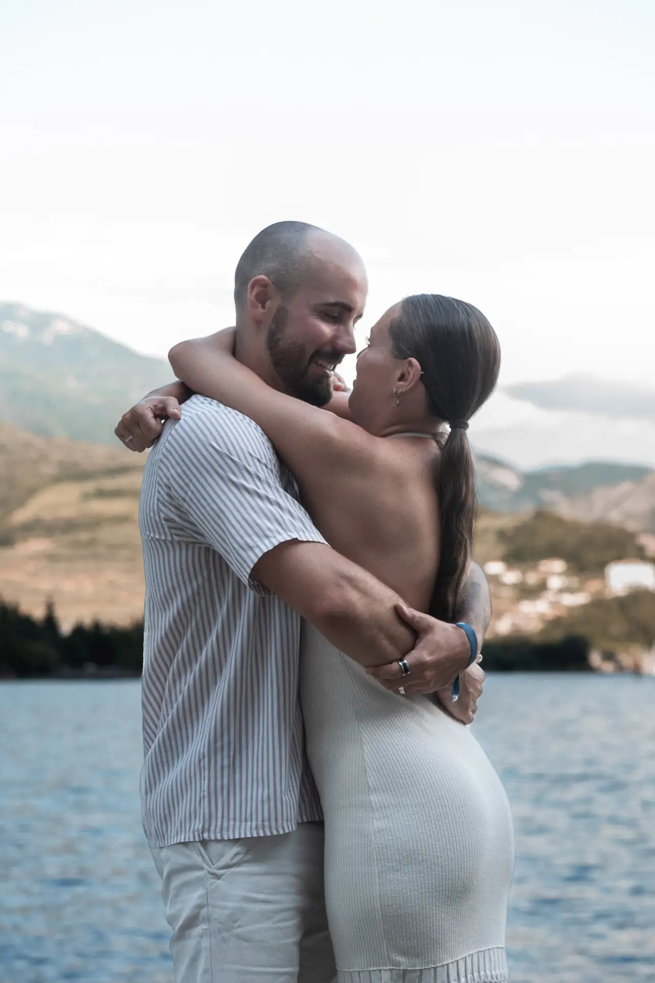 Aaron and Tamara hugging after the surprise proposal in Limone sul Garda