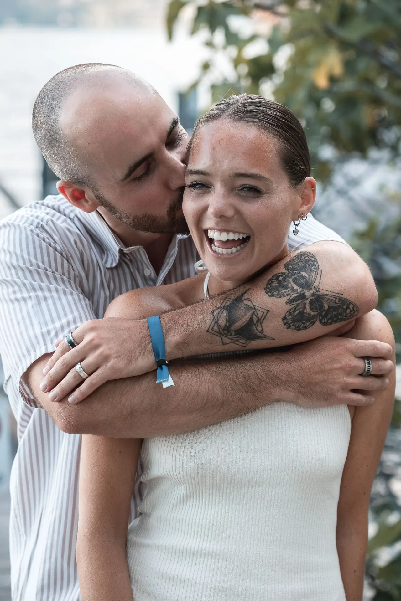 Aaron and Tamara hugging after the surprise proposal in Limone sul Garda
