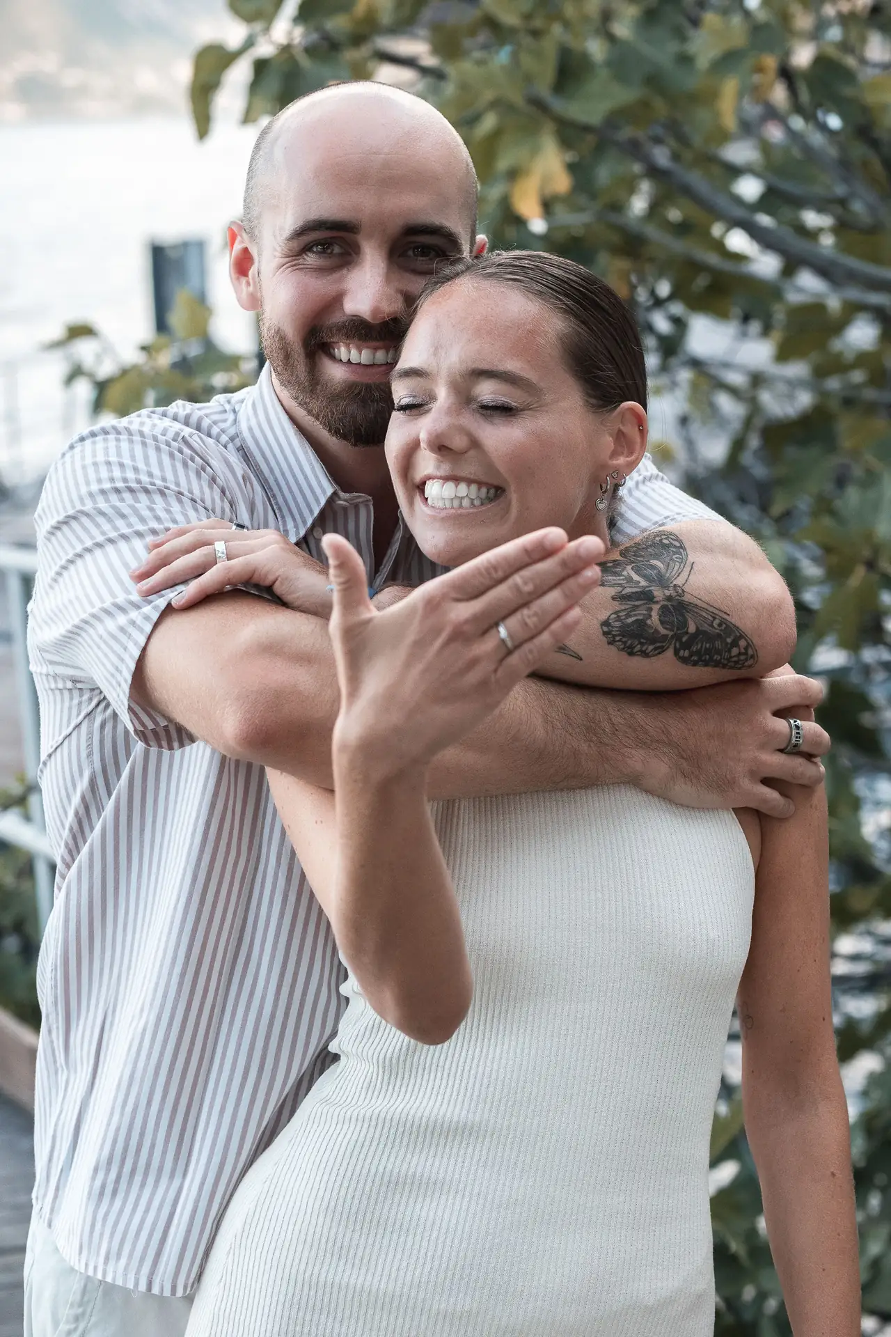 Aaron and Tamara hugging after the surprise proposal in Limone sul Garda