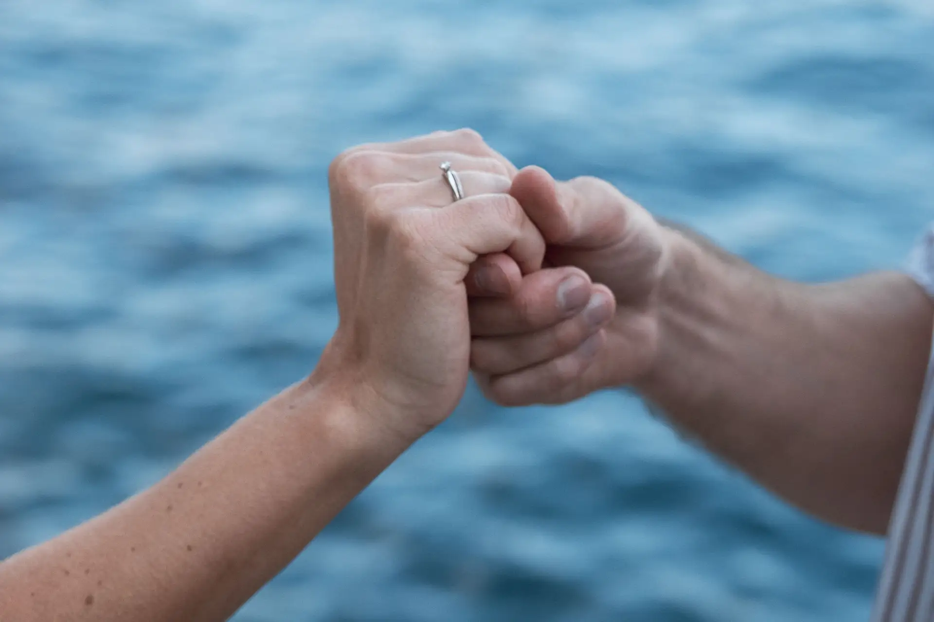 Aaron and Tamara hugging after the surprise proposal in Limone sul Garda