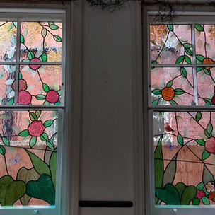 Traditional stained glass design depicting elements of an English garden