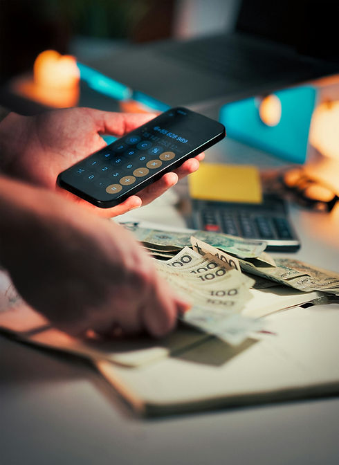 Person using calculator app on their phone to count money