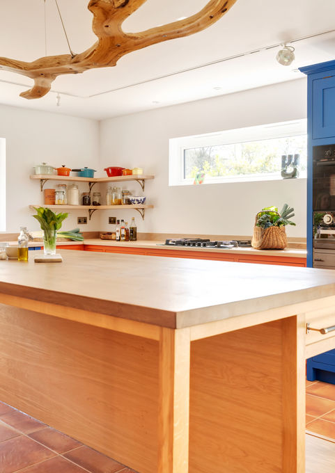 Hand crafted solid oak kitchen island. Hand painted shaker kitchen cupboards. Bespoke luxury oak furniture. High end, custom kitchen design. Sustainable hardwood kitchen. Hand made in Britain.