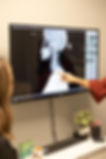 Chiropractor performing a neurological scan evaluation at Compass Chiropractic Whitefish