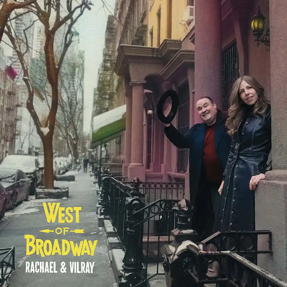 Two people stand on a snowy street, one tips a hat. Buildings line the background. Text: "West of Broadway, Rachael & Vilray."