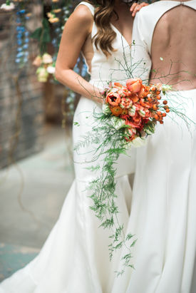 Mass MoCA industrial wedding,  LGBTQ+ wedding flowers, orange palette tulip bridal bouquet