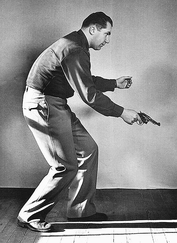 Colonel Rex Applegate demonstrates "Three-Quarter-Hip" technique