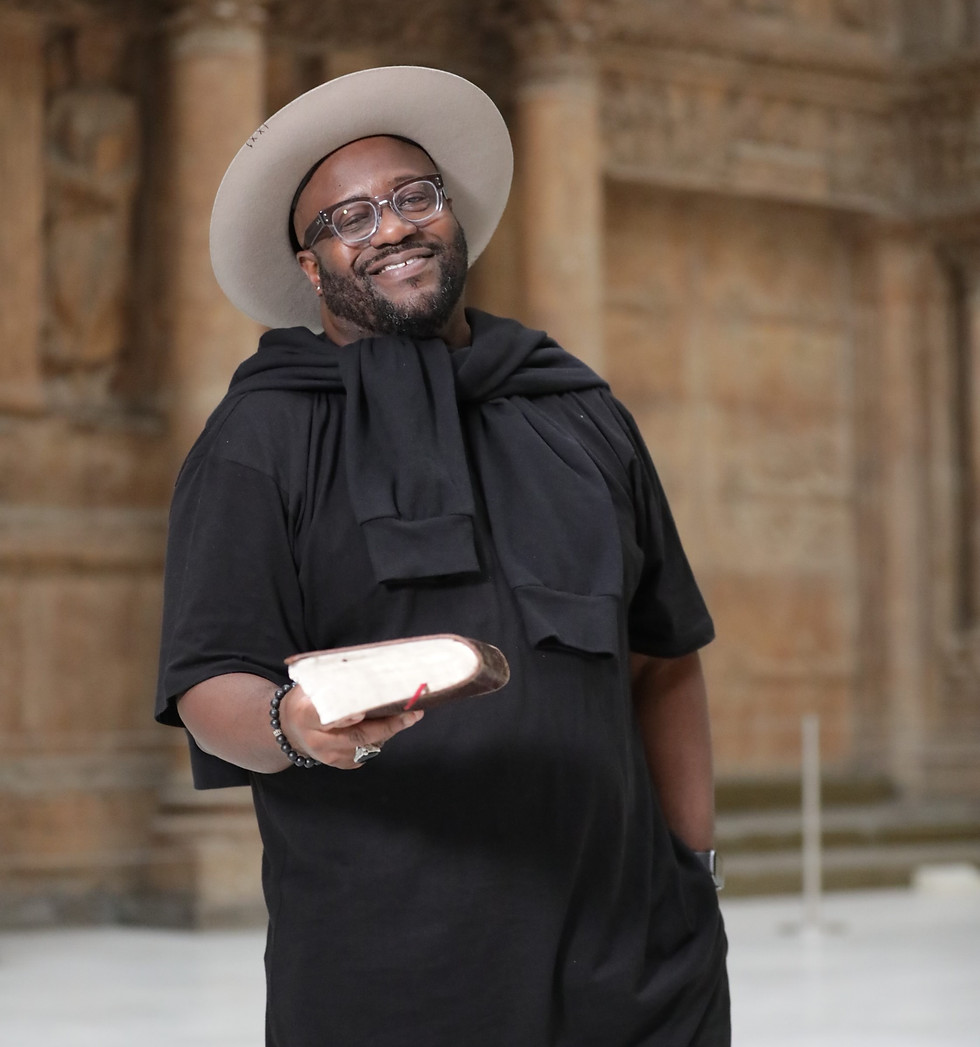 Dr. Eric Mason holding a book