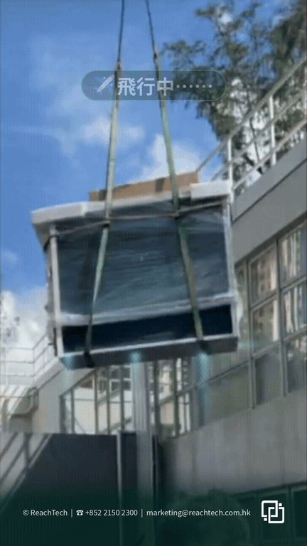 A crane lifts a wrapped all-in-one cabinet past a building facade towards the rooftop, with "Flying" and #SmartRow captions