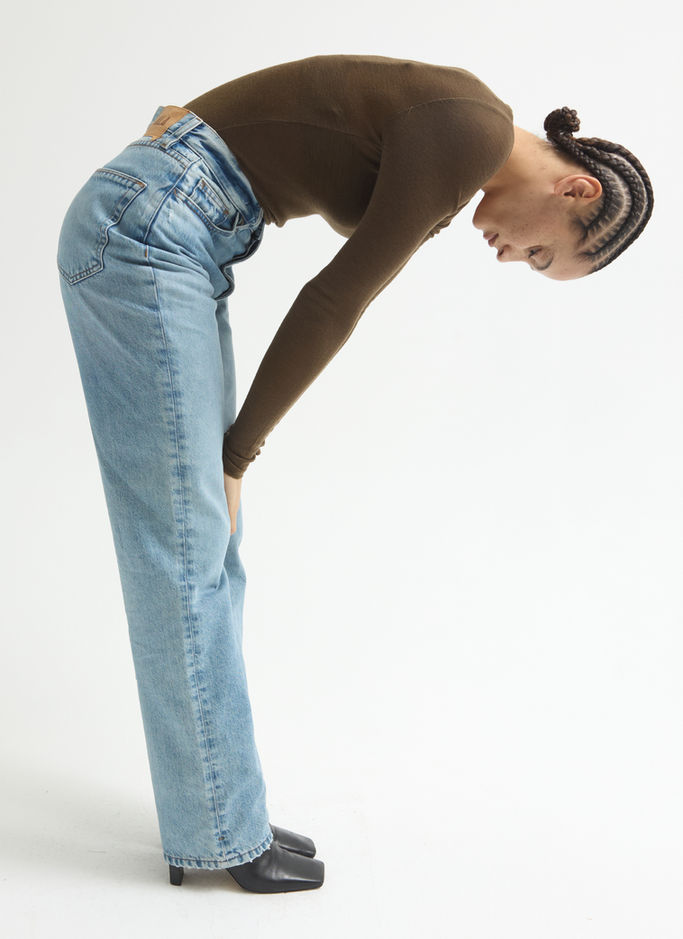 Studio beauty portrait of model looking directly into camera, soft lighting accentuating features