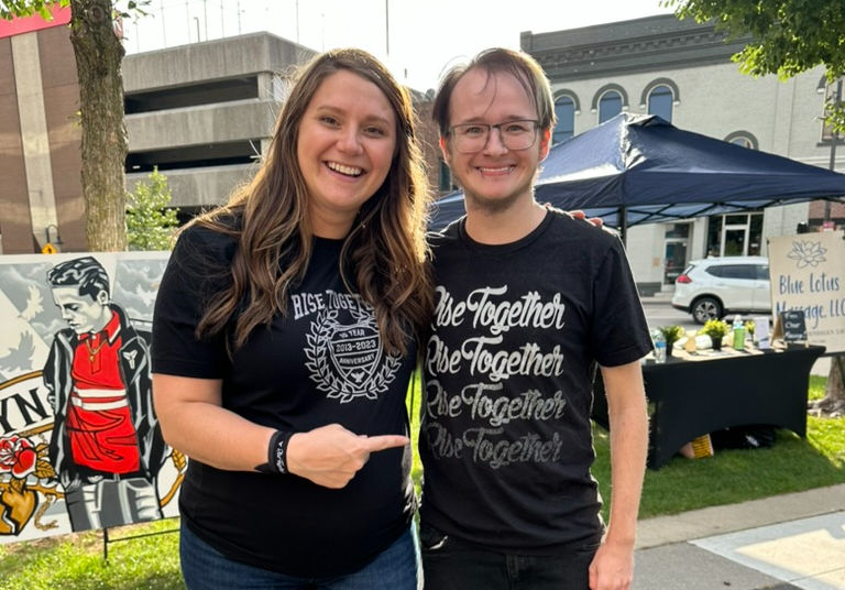 Nadine posing with former student coach