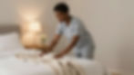 Housekeeper making a bed