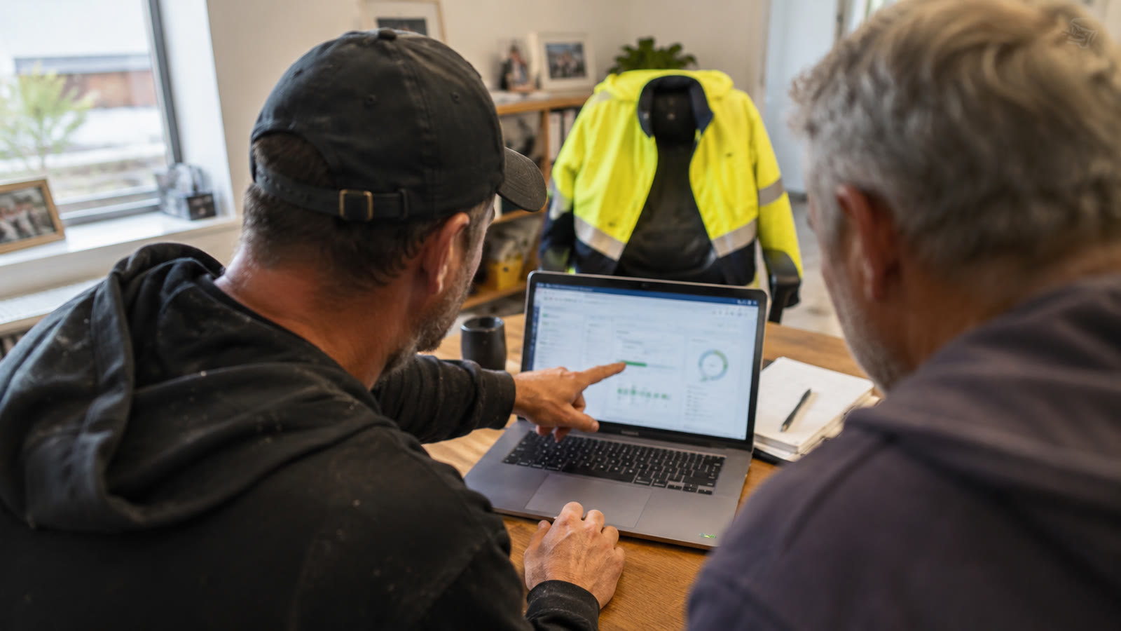 Hands typing on a laptop with a Xero dashboard on screen