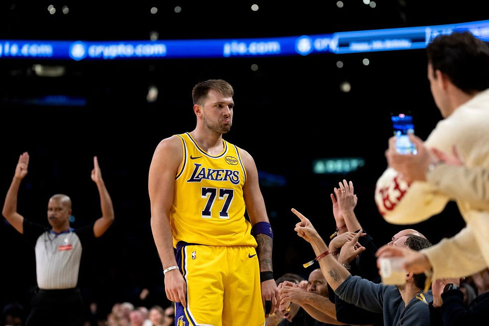Luka Dončić celebrates after scoring a three during his 49-point night against the Timberwolves.