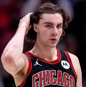 Chicago Bulls guard Josh Giddey drives to the basket during a game, fresh off signing a four-year, $100 million contract extension with the team.