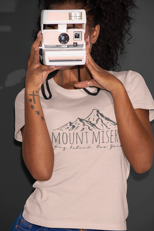 t-shirt-mockup-featuring-a-woman-taking-a-picture-with-a-polaroid-camera-21902.png