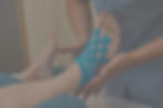 female-doctor-applying-blue-kinesio-tape-on-woman-2023-11-27-05-30-28-utc_edited_edited_ed