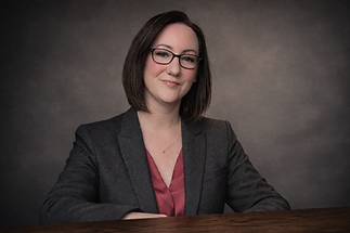 Amanda Cheryl, certified Co-Active coach, seated at a table