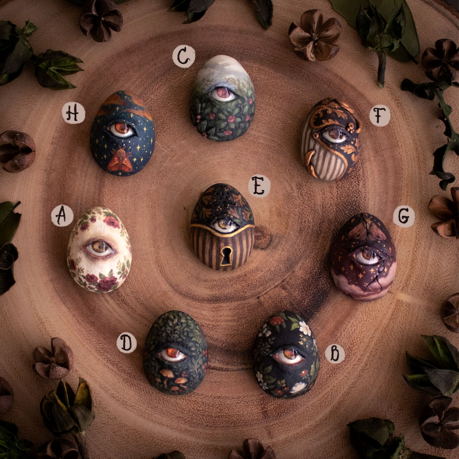 assortment of brooches, eggs with eyes uniquely painted