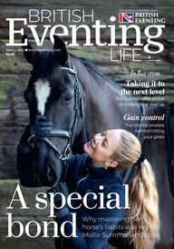 British Eventing rider Mollie Summerland hugging her horse Charly Van Ter Heiden.