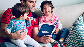 A parent reading with child during calm bedtime routine